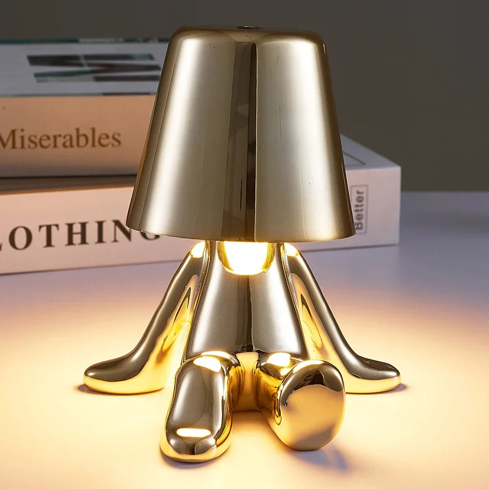 Bezprzewodowa lampka nocna LED z postacią człowieka w metalicznym połysku