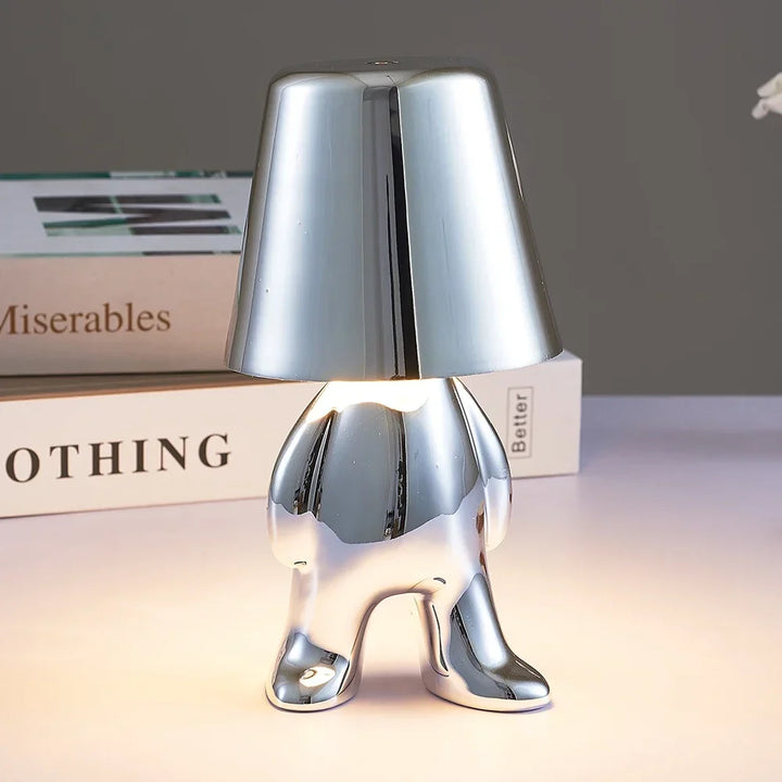 Bezprzewodowa lampka nocna LED z postacią człowieka w metalicznym połysku