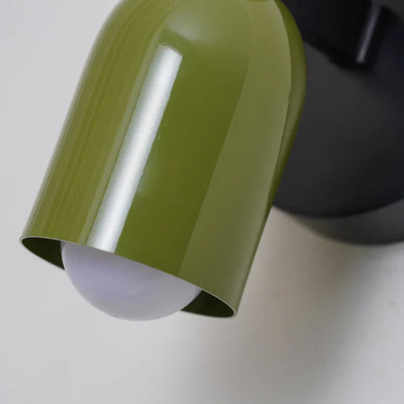 Dwukierunkowa lampa ścienna LED z cylindrycznym kloszem na okrągłej podstawie