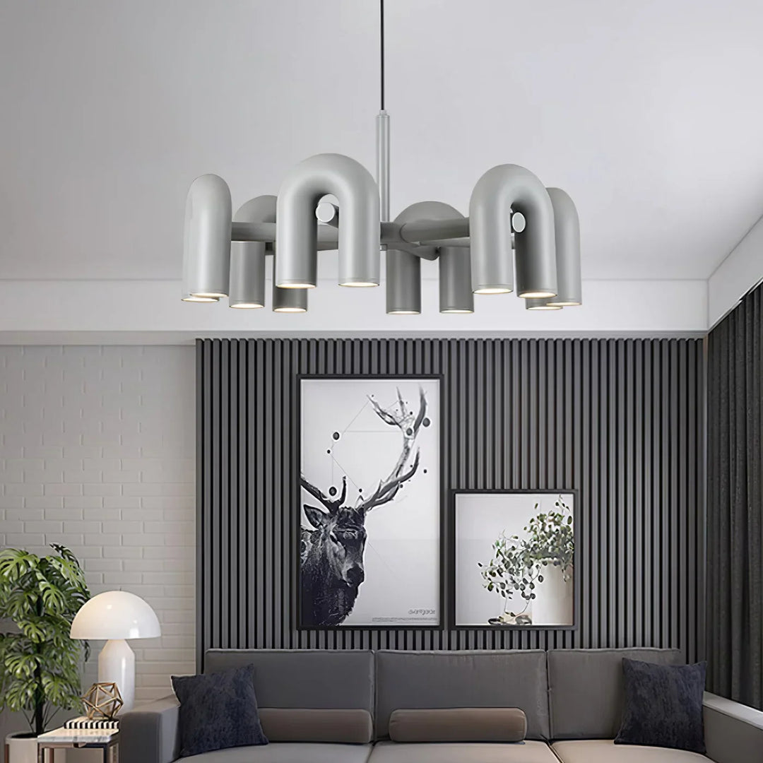 Lampa wisząca z cylindrycznymi punktami świetlnymi na łukowatych ramionach