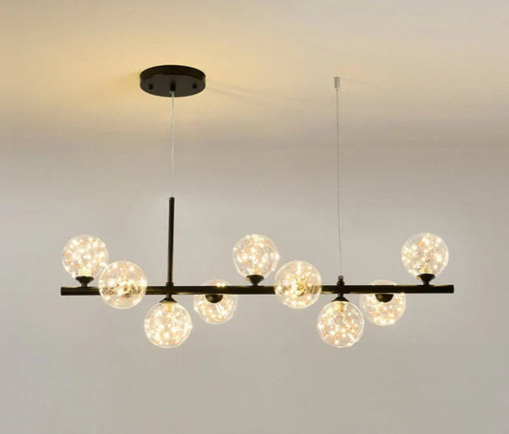 Lampa wisząca z poziomym ramieniem i kulistymi szklanymi kloszami