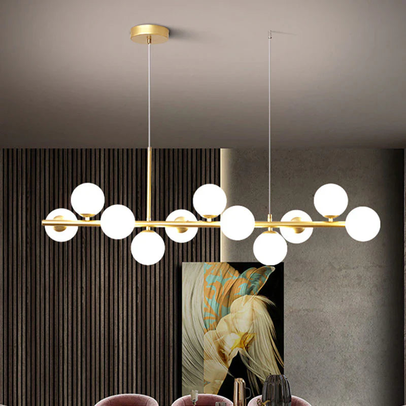 Lampa wisząca z poziomym ramieniem i kulistymi szklanymi kloszami