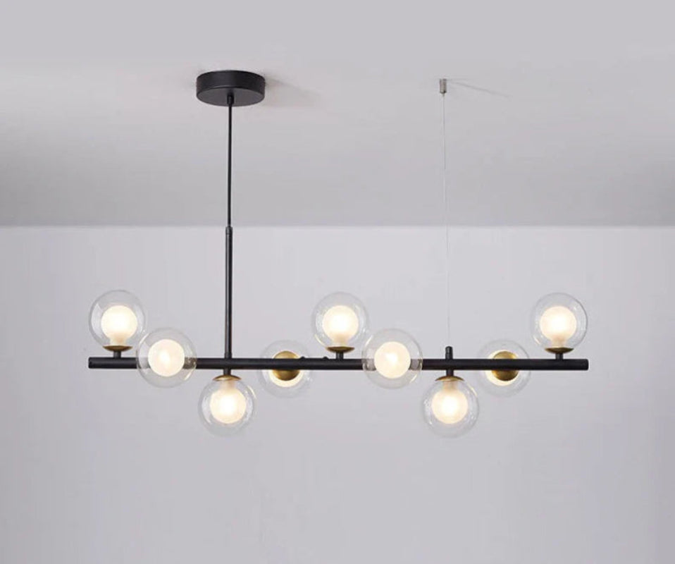 Lampa wisząca z poziomym ramieniem i kulistymi szklanymi kloszami