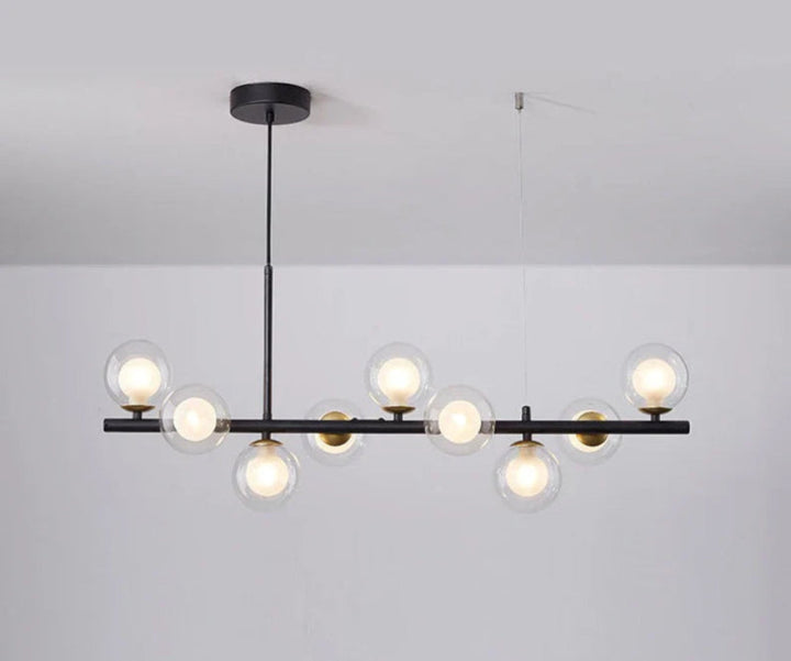Lampa wisząca z poziomym ramieniem i kulistymi szklanymi kloszami