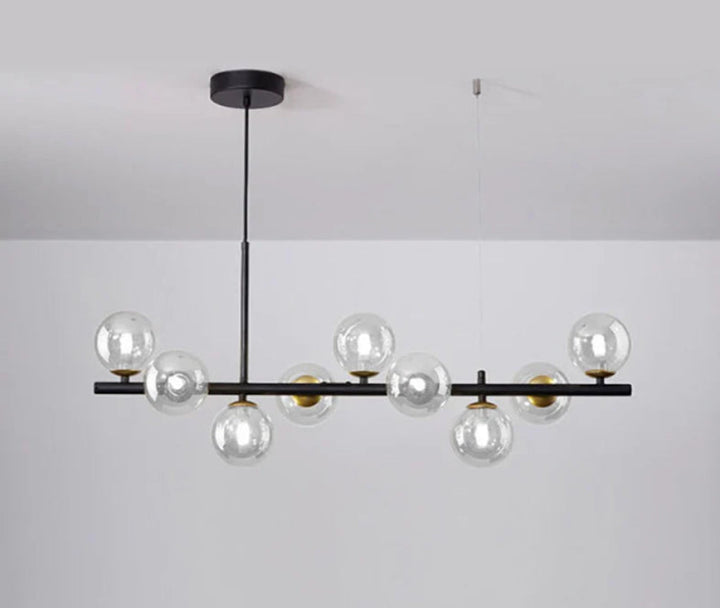 Lampa wisząca z poziomym ramieniem i kulistymi szklanymi kloszami