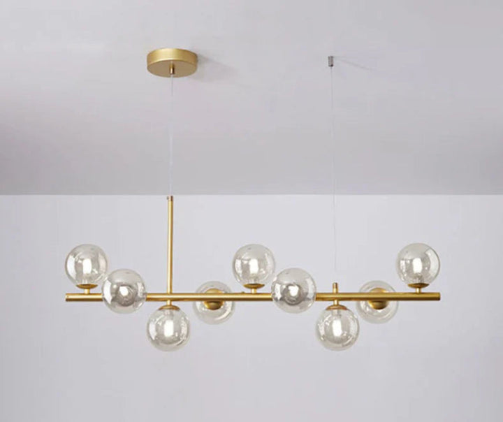 Lampa wisząca z poziomym ramieniem i kulistymi szklanymi kloszami