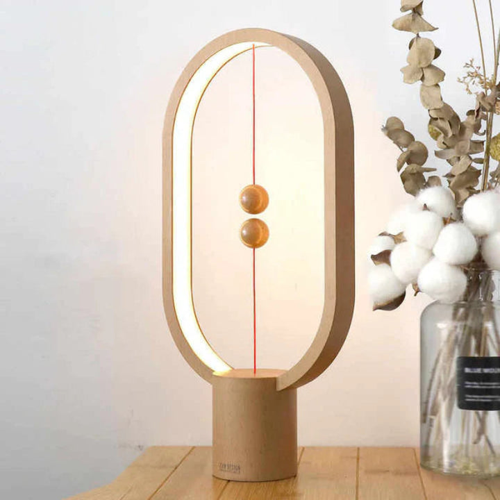 Lampka LED z magnetycznym wyłącznikiem owalna ramka z lewitującymi kulkami