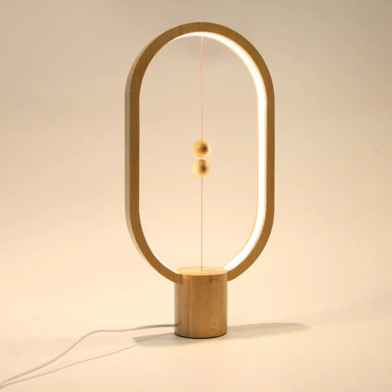 Lampka LED z magnetycznym wyłącznikiem owalna ramka z lewitującymi kulkami